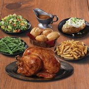 Swiss Chalet: Get a Family Pak with a Whole Rotisserie Chicken, Four Sides and Four Dinner Rolls for $25.00, Take-Out Only